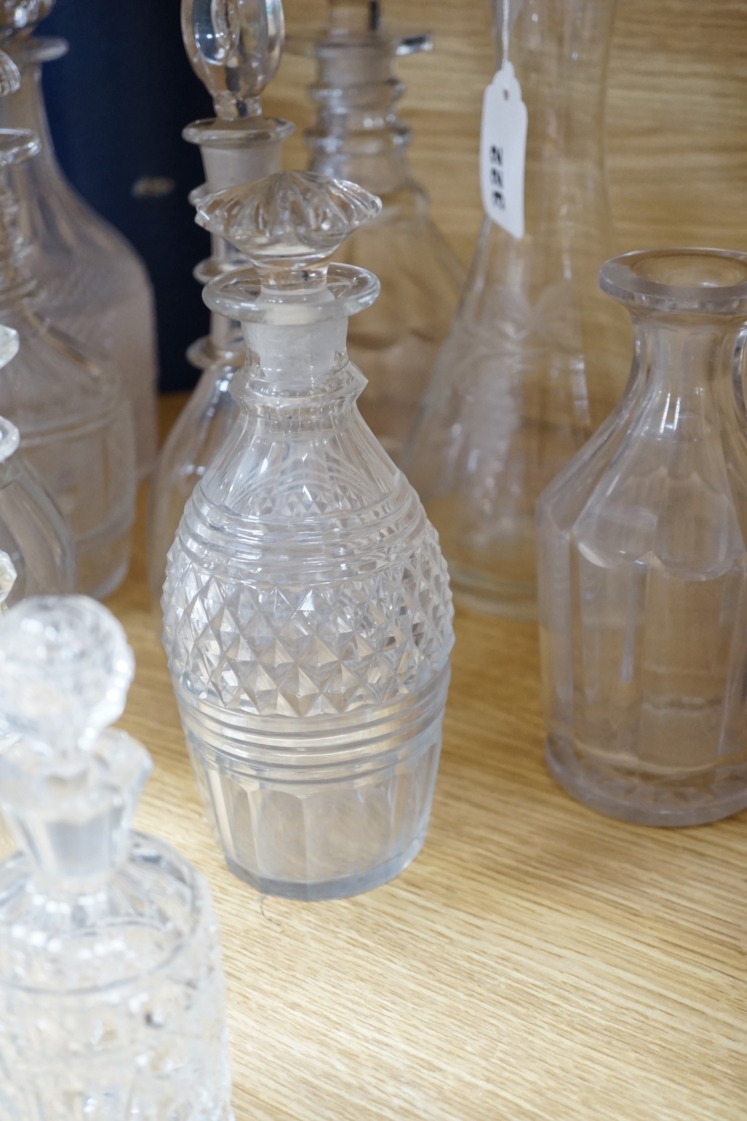 Twelve glass decanters and a carafe (13)